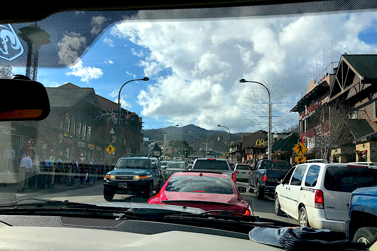 view out the windshield of traffic on gatlinburg's main street from inside a car